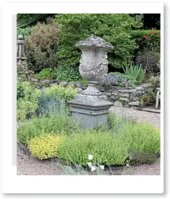  ??  ?? Mabel Annesley’s colourful and intimate walled garden at Castlewell­an.