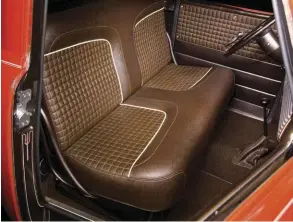  ??  ?? BOSS CUSTOM INTERIOR DRESSED THE SEAT WITH CUSTOM-MADE CUSHIONS AND BROWN VINYL UPHOLSTERY.