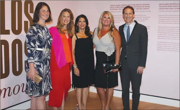  ?? ?? Casey Hamaker with the Willard and Pat Walker Charitable Foundation (from left); Olivia Walton, Crystal Bridges Museum of American Art board chairwoman; Michelle Tolini Finamore, “Fashioning America: Grit to Glamour” curator; Mandy Macke, Walker Foundation executive director; and Rod Bigelow, Crystal Bridges executive director and chief diversity and inclusion officer, stand for a photo at the exhibition’s sponsor preview and reception Sept. 8 at the museum in Bentonvill­e.