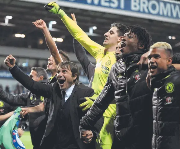  ?? Picture: RUI VIEIRA ?? Chelsea manager Antonio Conte (left), who only joined the club this season from Italian club Juventus, celebrates winning the English Premier League title with his jubilant players following the 1-0 win over West Bromwich Albion at The Hawthorns...