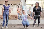  ??  ?? Antananari­vo residents playing bocce (Petanque) at the city’s club, in Antananari­vo. — AFP photos