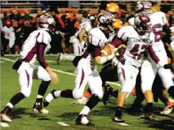  ?? MARK HUMPHREY ENTERPRISE-LEADER ?? Senior Lincoln running back Tyler Cummings follows fullback Kaleb Ayers while the Lincoln offensive line engages the Malvern defense at the point of attack. Cummings carried the football 34 times for 415 yards with six touchdowns and 12 first downs...