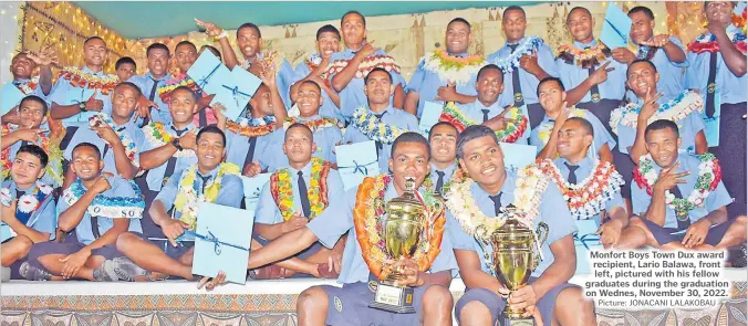  ?? Picture: JONACANI LALAKOBAU ?? Monfort Boys Town Dux award recipient, Lario Balawa, front left, pictured with his fellow graduates during the graduation on Wednes, November 30, 2022.