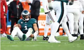  ?? ?? Jalen Hurts of the Philadelph­ia Eagles looks on after being sacked during the fourth quarter against the Arizona Cardinals at Lincoln Financial Field on Sunday afternoon. Photograph: Tim Nwachukwu/Getty Images
