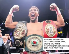  ??  ?? Anthony Joshua after reclaiming the IBF, WBA, WBO & IBO World Heavyweigh­t Championsh­ip belts from Andy Ruiz