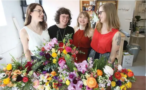  ?? VINCE TALOTTA PHOTOS/TORONTO STAR ?? The Wild North Flowers team features, from left Jacquelyn Lihou, Bethany Rose, owner Jennifer Fowlow and Stacey Sproule. Fowlow will use branches and weeds gathered around her house.