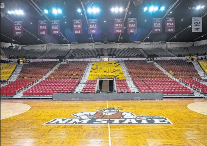  ?? Andrés Leighton The Associated Press ?? The basketball court of the Pan American Center at New Mexico State University sits empty after the men’s basketball season was canceled.