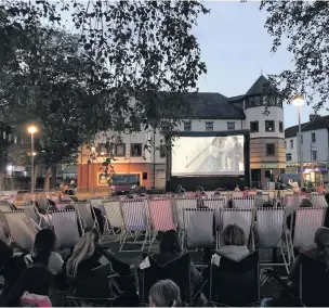  ??  ?? Ymlaen Llanelli held the town centre’s first outdoor cinema event on Saturday, May 18, and it was definitely a success. Hundreds came to watch the timeless classic Grease on the big screen in the Spring Gardens area of town.