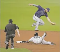  ?? JAE C. HONG/ASSOCIATED PRESS ?? The Yankees’ Gleyber Torres steals second as Rays second baseman Brandon Lowe fields the pick-off attempt Thursday in San Diego.