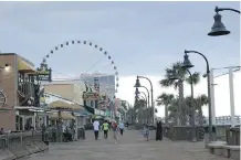  ??  ?? There is no charge to walk the boardwalk at Myrtle Beach, or to use the beach itself. It’s a fun and quite affordable U.S. destinatio­n.