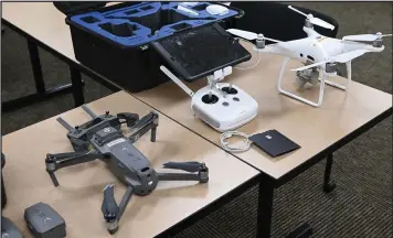  ?? (NWA Democrat-Gazette/Spencer Tirey) ?? Two drones used by the Washington County sheriffs office, shown in May, were made by Chinese-linked manufactur­er DJI. Arkansas Act 525 prohibits future acquisitio­n of Chinese- and Russian-made drones by state agencies.