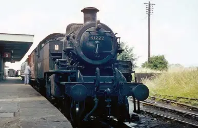  ?? Tony Doyle/R N Smith Collection ?? Bletchley shed’s lone Ivatt ‘2MT’, No 41222, is seen at Wolverton station while in use on its regular duties on the Newport Pagnall branch, south-east from the London & Birmingham section of the West Coast main line. This view was recorded on 16 July 1964, but the author visited and enjoyed the same traction on 29 August, by which time the branch was very close to its passenger demise on 7 September. It would continue as a goods-only route for a while but would be lost to the network on 22 May 1967, and by then the sands of time had also expired for No 41222, its final home being Carlisle (Kingmoor).