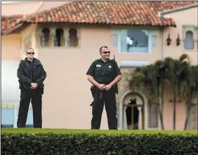  ?? The New York Times/SCOTT MCINTYRE ?? Palm Beach County Sheriff’s deputies stand guard outside the Mar-a-Lago club, where then President-elect Donald Trump was spending the Thanksgivi­ng holiday on Nov. 23, 2016.
