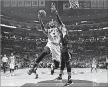  ?? PRESS] [JAE C. HONG/THE ASSOCIATED ?? The Cavaliers’ Derrick Williams drives to the basket against the Clippers’ Marreese Speights.