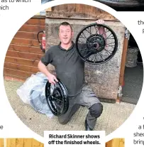  ??  ?? Richard Skinner shows off the finished wheels.