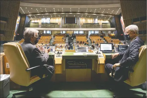  ?? (United Nations/Eskinder Debebe) ?? United Nations Secretary-General Antonio Guterres (left) and General Assembly President Volkan Bozkir from Turkey confer Monday prior to the start of the General Assembly meeting commemorat­ing the 75th anniversar­y of the United Nations in New York.