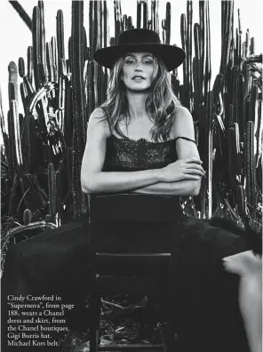  ??  ?? Cindy Crawford in “Supernova”, from page 188, wears a Chanel dress and skirt, from the Chanel boutiques. Gigi Burris hat. Michael Kors belt.