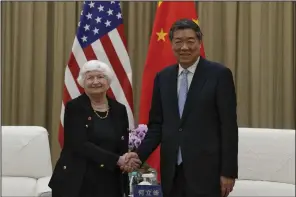  ?? (AP/Andy Wong) ?? U.S. Treasury Secretary Janet Yellen (left) shakes hands with Chinese Vice Premier He Lifeng as they arrive for a one-on-one meeting at the Guangdong Zhudao Guest House in southern China’s Guangdong province on Saturday.