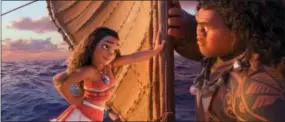  ?? THE ASSOCIATED PRESS ?? This image released by Disney shows characters Maui, voiced by Dwayne Johnson, right, and Moana, voiced by Auli’i Cravalho, in a scene from the animated film “Moana.”