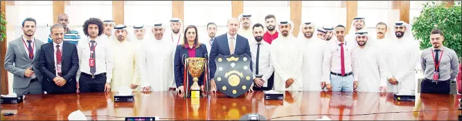  ??  ?? The Gulf Bank football team with officials of the bank