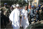  ?? Picture: REUTERS ?? STEPPING DOWN: Gambian President Yahya Jammeh arrives at a polling station with his wife Zineb during the presidenti­al election in Banjul, Gambia.