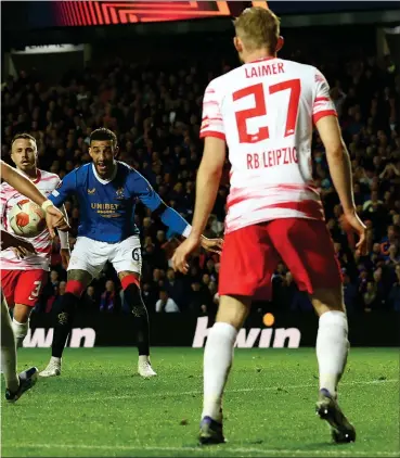  ?? ?? John Lundstram adds the third goal of the night for Rangers after James Tavernier’s opener (left)