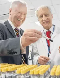  ??  ?? Alex Neil (left) and senior specialist in biochemist­ry David Cunningham.