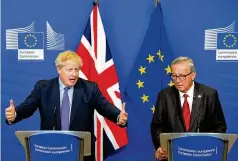  ?? SEAN GALLUP/GETTY IMAGES ?? British Prime Minister Boris Johnson (left), with European Commission President Jean-Claude Juncker in Brussels, Belgium, announces Thursday a deal has been struck on a Brexit withdrawal.