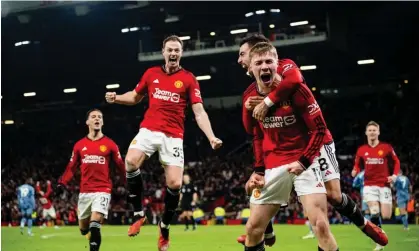 ?? Ash Donelon/Manchester United/Getty Images ?? Rasmus Højlund celebrates with his Manchester United teammates after scoring their third goal and winner against Aston Villa. Photograph: