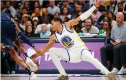  ?? Tribune News Service/bay Area News Group ?? Golden State Warriors’ Jordan Poole (3) fights for a loose ball against Golden State
Warriors’ Kevon Looney (5) in the first quarter of Game 4 of the team’s NBA basketball firstround playoff series at Ball Arena in Denver, Colo., on April 24.