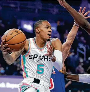  ?? Jeff Chiu / Associated Press ?? Spurs guard Dejounte Murray is trying to keep focused on team goals amid what is becoming a career year that could lead to his first All-star selection. Said Murray: “We win, everybody eats.”