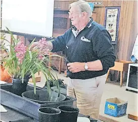  ??  ?? Alex Mentiplay from the West Gippsland Orchid Society describes how to divide and repot Orchids during his presentati­on