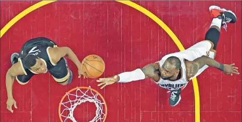  ?? TONY DEJAK / AP ?? LeBron James of the Cleveland Cavaliers lays up a shot against the Toronto Raptors’ Kyle Lowry in Game 2 of their NBA Eastern Conference semifinal on Wednesday in Cleveland. James scored 39 points to help the Cavs to a 125-103 victory and a 2-0 series...