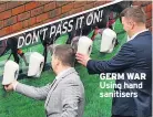  ??  ?? GERM WAR
Using hand sanitisers