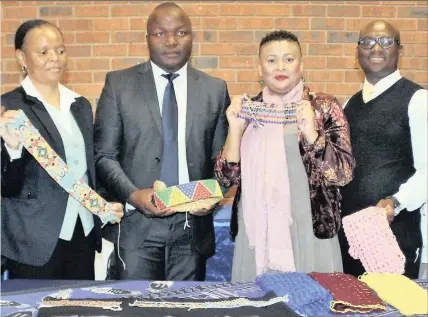  ??  ?? Showing off the bead work of exhibitors at the Imbokodo Iyazenzela Women in SMMEs session in Ulundi recently are, from left: Silindile Buthelezi, branch manager at Ithala; Musawenkos­i Phakathi, Ulundi Municipali­ty LED manager; Sitandiwe Dimba, Ithala...