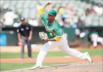  ?? Thearon W. Henderson / Getty Images ?? The Athletics’ Frankie Montas pitches against the New York Yankees in the top of the first inning on Saturday.