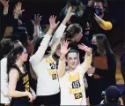  ?? Ronald Cortes / Associated Press ?? Iowa guard Caitlin Clark (22) and the rest of the team acknowledg­e the fans after defeating Kentucky in the second round of the NCAA tournament on Tuesday.