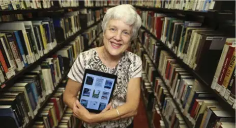  ?? RICHARD LAUTENS/TORONTO STAR ?? Anne Bailey, Toronto Public Library’s director of branch libraries, had the idea of installing a book-lending machine — the city’s first — in Union Station.