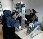  ?? AFP ?? STAR GIRLS : Workers of an all-female robotic team build a ventilator for Covid-19 patients, at a workshop in Herat. —