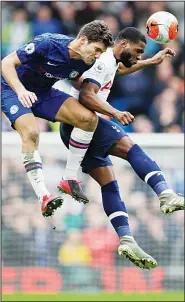  ??  ?? Chelsea’s Marcos Alonso and Tottenham Hotspur’s Japhet Tanganga jump for the ball during their English Premier League soccer match in London, on Feb 22. (AP)