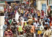  ??  ?? Stranded migrant workers wait for packaged food, distribute­d by Central Reserve Police Force (CRPF), during the nationwide lockdown in the wake of coronaviru­s pandemic, in Chennai