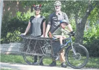  ?? STEVE RUSSELL TORONTO STAR ?? “It really does get a lot of attention,” Chris Williams says of the admiring glances his family gets while on their cargo bike.