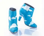  ??  ?? Prince rocked these iconic blue ankle boots with hand-painted white clouds in his “Raspberry Beret” music video, along with a matching suit.