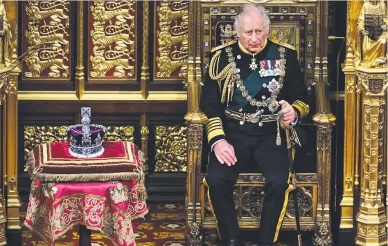  ?? ?? Prince Charles sits next to the Imperial State Crown. Picture: AFP