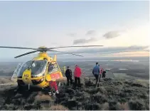  ??  ?? Rescue Helimed 76 lands on hillside near Dollar to assist stricken walker