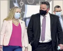  ??  ?? Albany County Department of Health Commission­er Dr. Elizabeth Whalen, left, and Mccoy enter the briefing room Tuesday. Mccoy suggested contact tracers have had difficulty because infected individual­s are not being forthright when questioned.