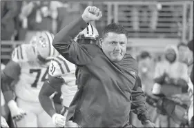  ?? AP/THOMAS GRANING LSU head coach Ed Orgeron leads the team on the field before the first half on Nov. 16 against Mississipp­i in Oxford, Miss. ??