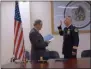  ?? FRANCINE D. GRINNELL — MEDIANEWS GROUP ?? Assistant City Attorney Tony Izzo reads the oath of office to Chief of Police Shane Crooks at Tuesday’s ceremony in which Crooks became the 21st to hold the position.