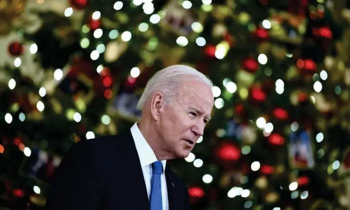  ?? Photograph: Brendan Smialowski/AFP/Getty Images ?? Joe Biden speaks at the White House on 21 December.