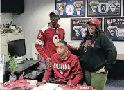  ?? BY RYAN ABER, THE OKLAHOMAN] [PHOTO ?? Allen (Texas) wide receiver signee Theo Wease Jr. with his parents after signing with Oklahoma on Wednesday.